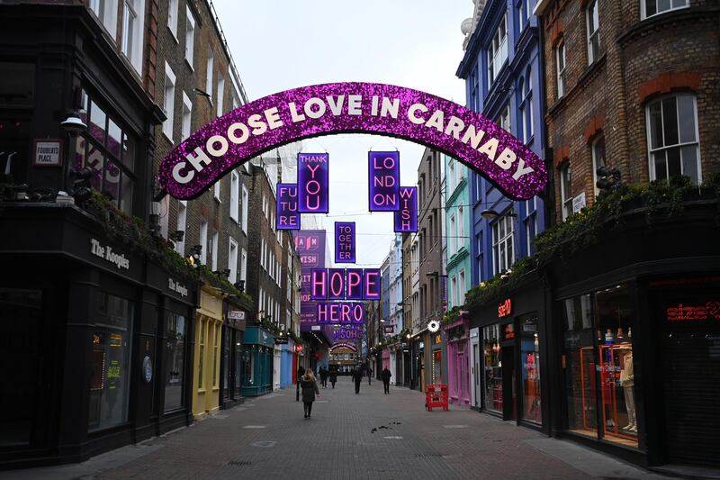 A near empty Carnaby Street in London. Harsher Covid restrictions now apply to millions more people, as rule changes come into force across the UK. EPA