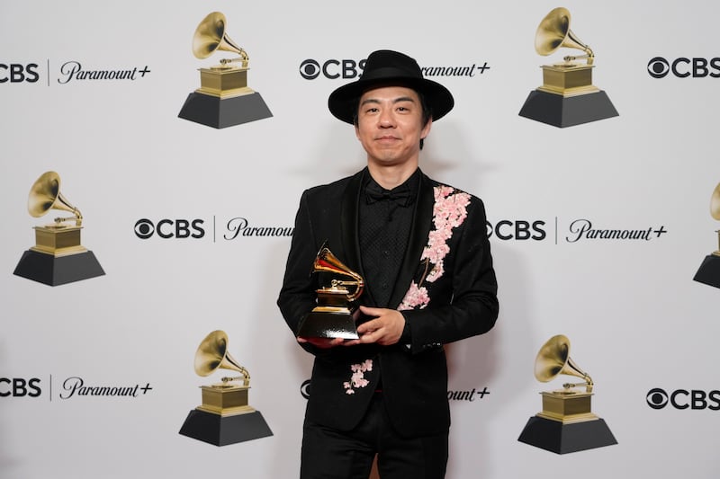 Masa Takumi with the award for Best Global Music Album for Sakura. AP