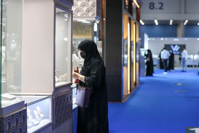 Visitors at the Jewellery & Watch Show at Abu Dhabi National Exhibition Centre. Adnec has committed to creating net-zero events. Khushnum Bhandari / The National