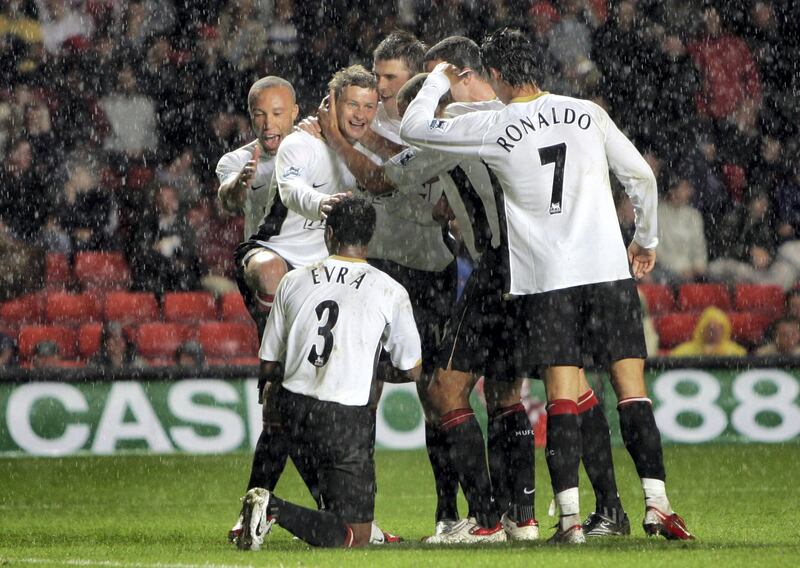 Manchester United's Ole Gunnar Solskjaer, second right, celebrates his goal with team mates during their English Premier League soccer match against Charlton Athletic at the Valley Stadium, London, Wednesday, Aug. 23, 2006. (AP Photo/Tom Hevezi) ** NO INTERNET/MOBILE USEAGE WITHOUT FAPL LICENCE - SEE IPTC SPECIAL INSTRUCTIONS FIELD FOR DETAILS** 