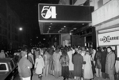 Crowds linger outside the entrance to Studio 54 in New York, Nov. 6, 1979.  (AP Photo/Richard Drew)