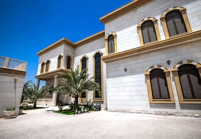 The house's stone-striped arches bring traditional Damascus architecture to Qarayen suburb, Sharjah. Victor Besa / The National