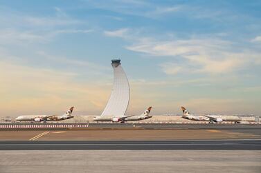 Etihad jets at Abu Dhabi International Airport in March last year after the UAE grounded passenger flights to prevent the spread of Covid-19 via air travel. Courtesy Etihad 