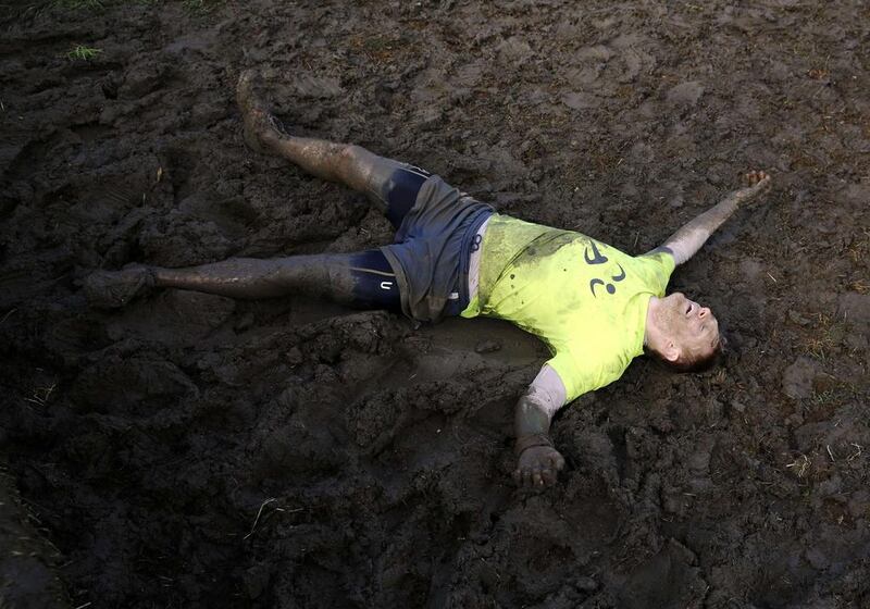 A competitor participates in the Tough Mudder challenge near Winchester in southern England on Saturday. Luke MacGregor / Reuters