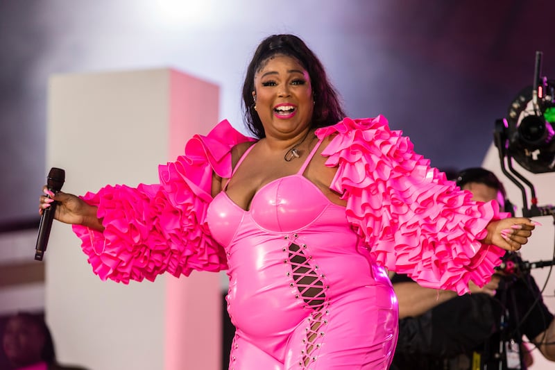 Lizzo wears a hot pink bodice with ruffled sleeves during the Global Citizen festival on September 25, 2021. AP