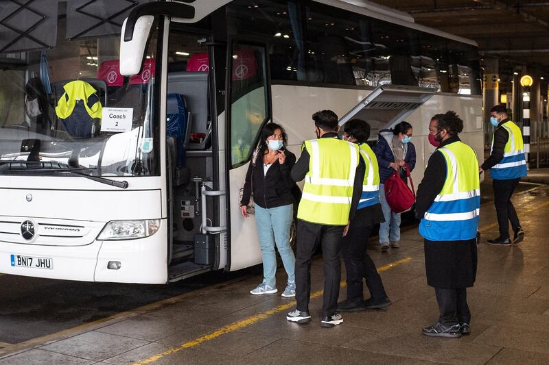 Passengers arriving in the UK from a 'red list' country are escorted through Heathrow Airport on to a coach for transfer to a quarantine hotel. Getty Images