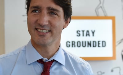 Liberal Leader Justin Trudeau smiles as he campaigns in Toronto on Friday, Sept. 20, 2019.  Trudeau says he doesn't recall the pictures of his wearing blackface and brownface that have recently surfaced. Trudeau's campaign is trying to contain a growing furor after a yearbook photo surfaced of him in brownface at a 2001 "Arabian Nights" costume party and two other similar incidents came to light. With his bid for re-election just a month away, the 47-year-old Trudeau is begging Canadians to forgive him.  (Sean Kilpatrick/The Canadian Press via AP)