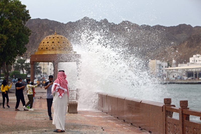 High waves break on the seaside promenade in Muscat. Oman declared a two-day national holiday on Sunday and Monday, urging people to stay indoors.