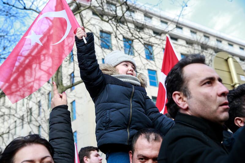 People from Turkish communities welcome Turkish President Erdogan ahead of a meeting and a press conference with NATO Secretary General Jens Stoltenberg in Brussels.  EPA