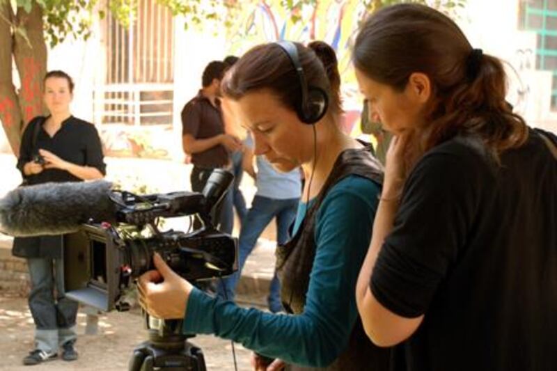 The Dutch filmmaker Shuchen Tan, centre, shooting on location in Baghdad. Her documentary, Baghdad Film School, which screened at DIFF this week, highlights not only the everyday troubles of life in a country reeling from dictatorship, invasion and civil war, but the tremendous risks so often taken by people determined to learn the art of filmmaking.