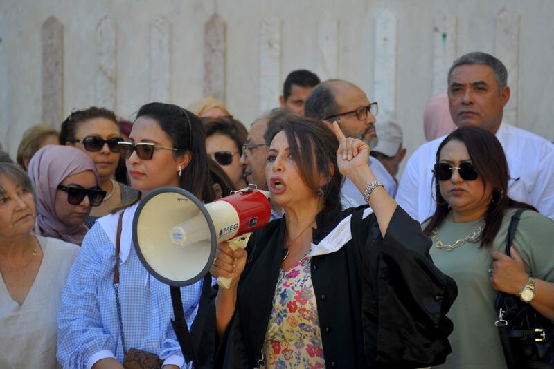 Lawyers and activists gather on the steps of the Palace of Justice in Tunis during a protest in 2022. AP
