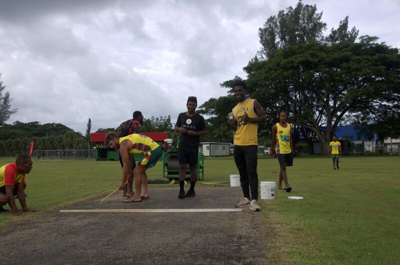 Players prepare the wicket for the match between Mele Village and Port Vila. Courtesy Vanuatu cricket