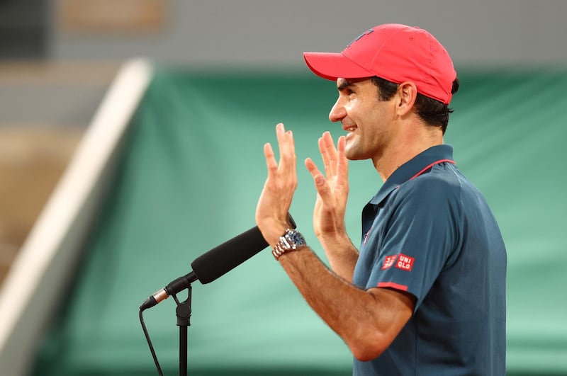 Roger Federer is interviewed after winning his match against Dominik Koepfer at Roland Garros. Getty