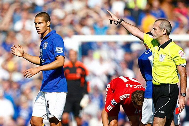 Martin Atkinson, the referee, sends off Jack Rodwell, the Everton midfielder during the 216th Merseyside derby which Liverpool won 2-0.

Tim Hales / AP Photo