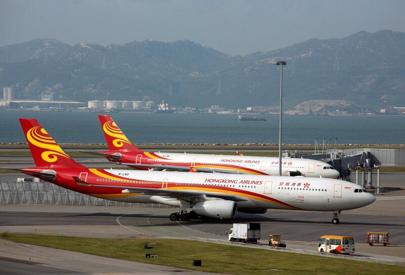 A Hong Kong Airlines Airbus A330-300 passenger plane taxies on the tarmac at the Hong Kong Airport September 11, 2013. The Civil Aviation Department said that the current hourly Chek Lap Kok airport runway capacity reached 64 sorties, an increase of 24 sorties since 1999, and is expected that it will reach the maximum capacity of two runways of 68 vehicles in 2015, local media reported. REUTERS/Tyrone Siu (CHINA - Tags: BUSINESS TRANSPORT)