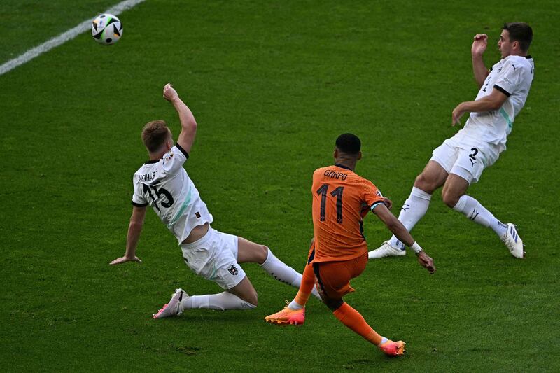 Cody Gakpo scores the Netherlands' first goal. AFP