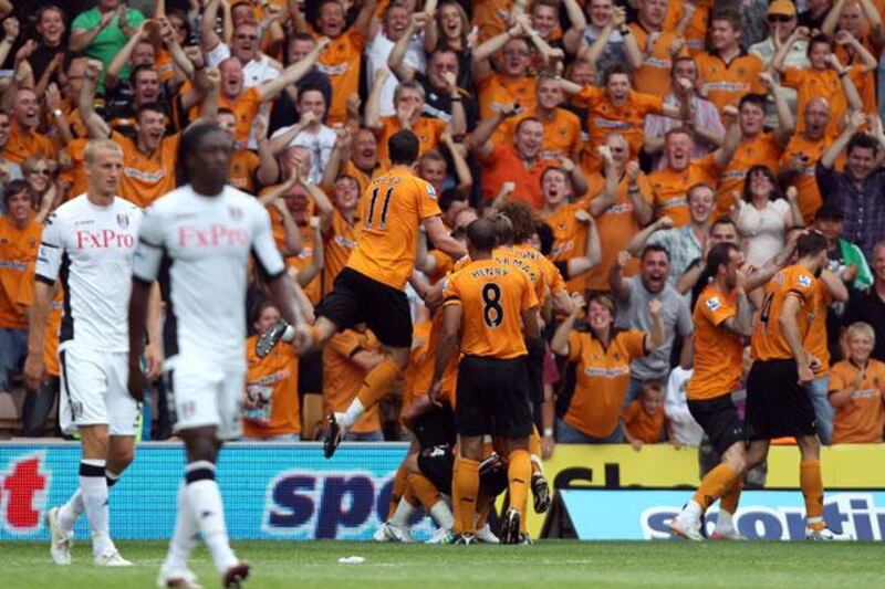 Matt Jarvis and the Wolves team celebrate their second goal in front of their fans as they provisionally went top of the Premier League.

Ross Kinnaird / Getty Images