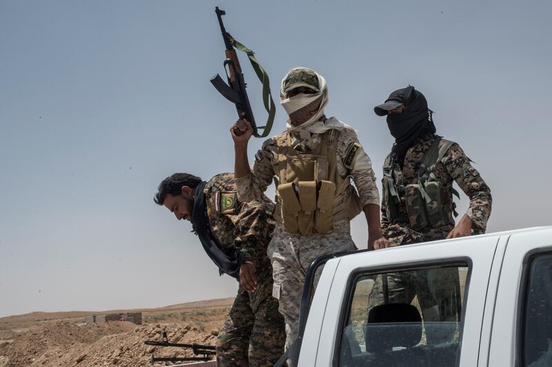 Iraqi Popular Mobilisation Front forces fighters on June 20, 2017 on the Iraq-Syria border in Nineveh, Iraq. The prime minister said leaders of such militias would not be allowed to stand for election.