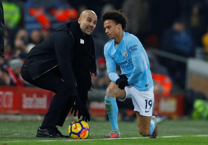 Soccer Football - Premier League - Liverpool vs Manchester City - Anfield, Liverpool, Britain - January 14, 2018   Manchester City manager Pep Guardiola speaks with Leroy Sane             REUTERS/Phil Noble    EDITORIAL USE ONLY. No use with unauthorized audio, video, data, fixture lists, club/league logos or "live" services. Online in-match use limited to 75 images, no video emulation. No use in betting, games or single club/league/player publications.  Please contact your account representative for further details.