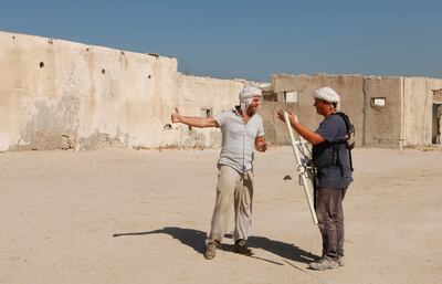 Sharjah, 30th October 2011.  ( Left to right ) Kristian Strutt ( Archaelogist from Archaelogical Prospection Services ) and Matt Brewer ( a Phd student from UK ), gestures before doing the mapping at the Al Khan archaeological site.  ( Jeffrey E Biteng / The National )  