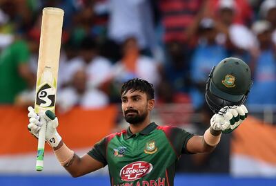 Bangladesh batsman Liton Das celebrates after scoring a century (100 runs) during the final one day international (ODI) Asia Cup cricket match between Bangladesh and India at the Dubai International Cricket Stadium in Dubai on September 28, 2018. / AFP / ISHARA S. KODIKARA
