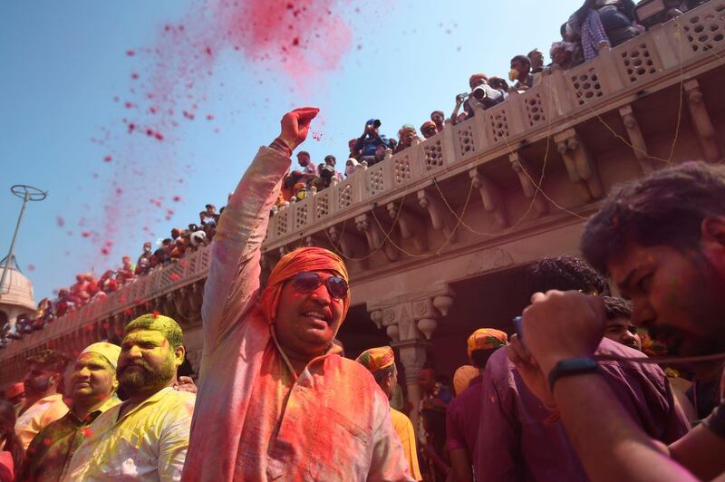 Hindu devotees celebrate Holi, the spring festival of colours, during a traditional gathering at a temple in Nandgaon village in Uttar Pradesh state on March 5, 2020. Holi is observed in India at the end of the winter season on the last full moon of the lunar month. AFP