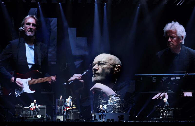 From left, Mike Rutherford, Phil Collins and Tony Banks, members of British rock band Genesis, perform at a concert in Nanterre, France. AFP