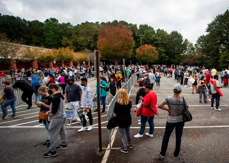 Hundreds of people wait in line for early voting, in Marietta, Georgia. AP Photo