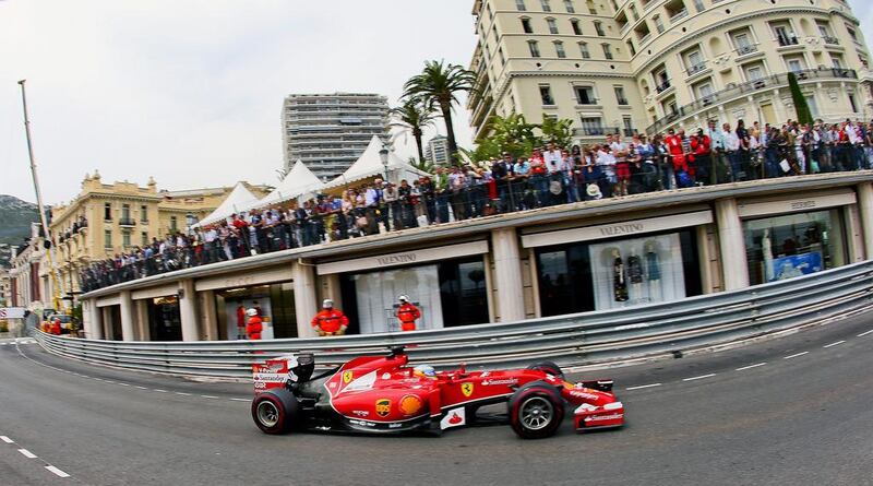 Ferrari driver Fernando Alonso winds through the street corse during Sunday's Monaco Grand Prix. Srdjan Suki / EPA