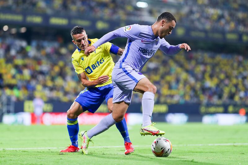 Barcelona's Sergiño Dest competes for the ball with Salvi Sanchez of Cadiz. Getty Images