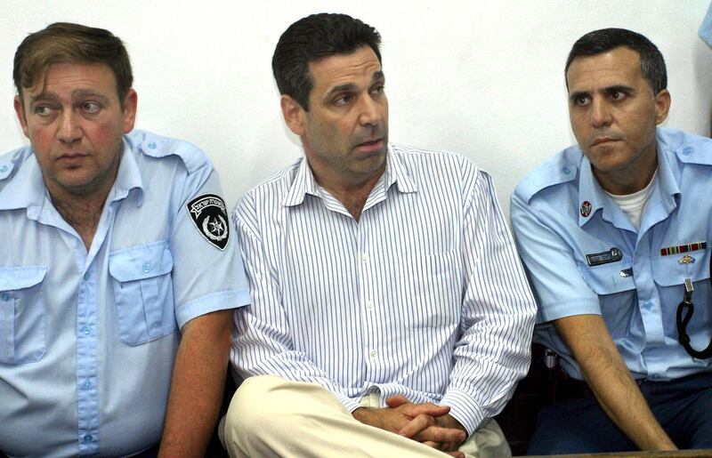 Former Israeli energy minister Gonen Segev (C) appears at the Tel Aviv district tribunal 22 April 2004. Segev was remanded in custody after having been arrested on suspicion of attempted drug-trafficking. The court ordered that Segev remain in custody until April 28. Segev, who had served as a minister in the cabinet of the late Labour party prime minister Yitzak Rabin, is accused of trying to smuggle 25,000 ecastasy tablets from Holland by changing the date on an out-of-date diplomatic passport. AFP PHOTO/Yariv KATZ -- ISRAEL OUT / AFP PHOTO / YARIV KATZ
