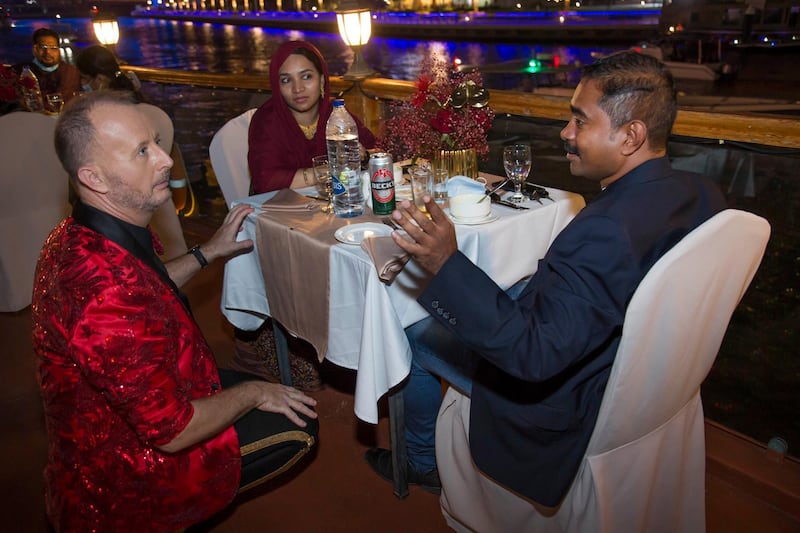 Dubai, United Arab Emirates - Richard the man behind the Big Ticket draw with Bouchra Yamani talking to  the winners at the gathering of of Abu Dhabi Big Ticket winners at Alexandra Dhow Cruise, Dubai Marina.  Leslie Pableo for The National for Sarwat Nasir's story