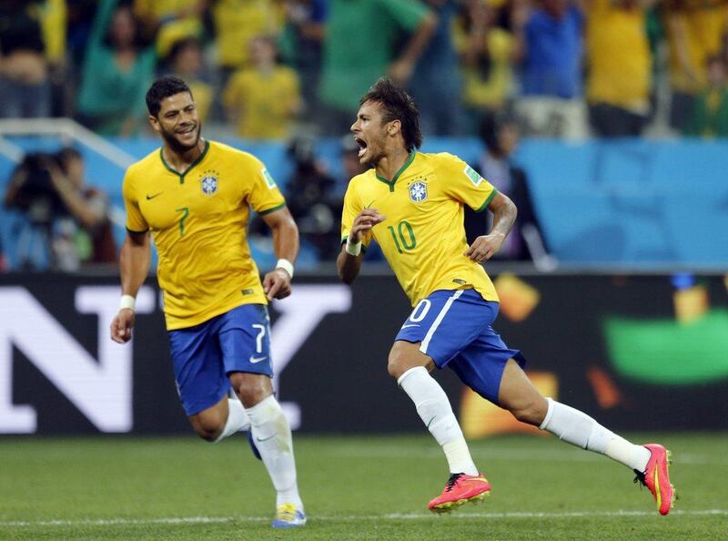 Hulk, left, and Neymar, right, celebrate during one of Brazil's goals in their World Cup 2014 opener against Croatia. Frank Augstein / AP / June 12, 2014