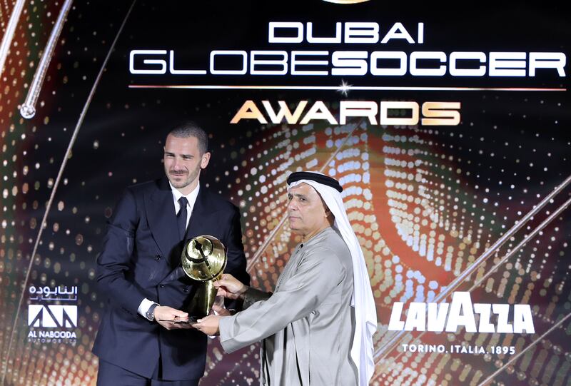 Juventus defender Leonardo Bonucci is given the best defender of the year award at the Globe Soccer Awards by Mattar Al Tayer, Vice Chairman of Dubai Sports Council.