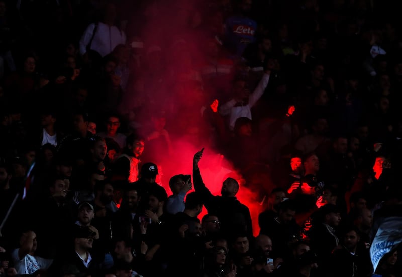 Fans of Napoli light a flare during the match. Getty Images