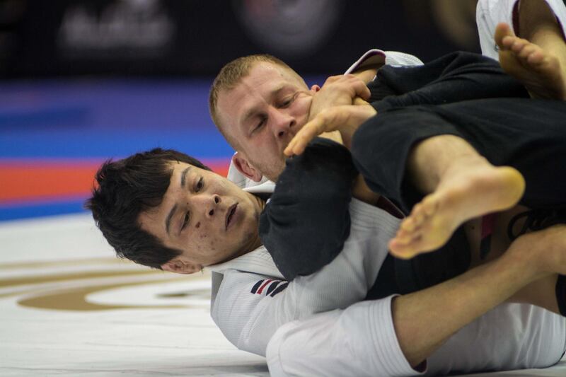 Paulo Miyao, in white, on his way to winning two golds in London. Courtesy UAEJJF
