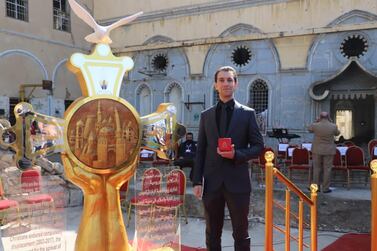 Omar Qais, a sculptor from Mosul, made a cross that was presented to Pope Francis during his visit to the Iraqi city. 