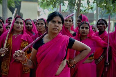 Sampat Pal Devi and her Gulabi Gang. Sampat pal Devi the commander of Gulabi Gang fights for women empowerment, justice and rights among the poor people of Bundelkhand region of Uttar Pradesh. Sampat Pal Devi comes from a poor family in Bundelkhand - the poorest region of India. The region is fraught with abject poverty, gross under development, lack of law and order, and stark casteism in which the Brahmins and other higher caste people treat their low caste brethren with disdain. Out of such situation when Sampat Pal Devi decided to speak up for the poor, she has been winning heart felt gratitude of the poor as well as enmity of the high caste people and grudging respect of the law enforcement officials who used to be largely inactive in these badlands of North India. Initially, she began with helping distressed women - victims of domestic violence and dowry system, but soon started getting other cases of nature of land dispute and under development. She emerged as a fiery leader in 2007, when she beat up the OC of the local police station while demanding release of a dalit woman kept locked up in the cell for thirteen days without being charged with a case.Today, she has a huge fan following of some 25 hundreds of thousands of women (spread across 8 districts of the state of UP) who have come to be known as Gulabi Gang or Pink Vigilante Women for their vibrant pink sarees - the costume of the gang; and fiery nature of dealing with injustice. When verbal negotiations for justice fail they resort to beating up. Sampat Devi is viewed as a messiah with the promise of bringing back law and order for the poor, in these mafia troubled areas. Today, perpetrators are simply scared of her as she does not hesitate to challenge law and order and even system - to win justice for the poor. More complaints related to domestic violence and other problems are registered now with the police than they ever used to be. She being one of the Other Backward Caste people in the region i