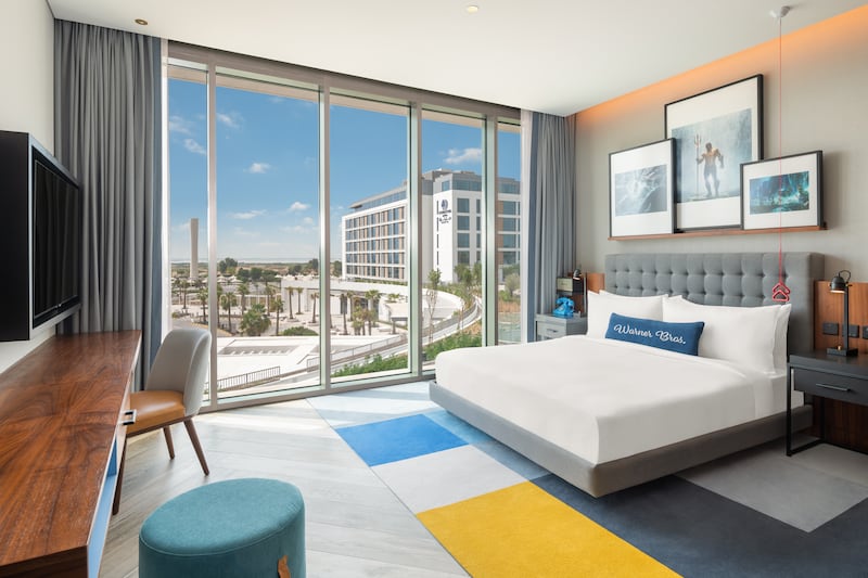 All rooms have floor-to-ceiling windows offering view over Yas Island and the swimming pool. Photo: Hilton 