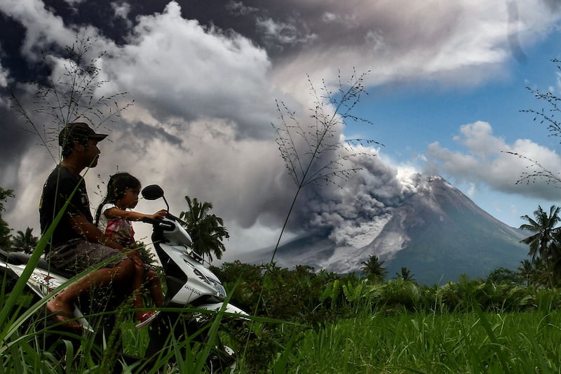 Thick smoke rises during an eruption from Mount Merapi, Indonesia’s most active volcano, as seen from Tunggularum village in Sleman on March 11, 2023.  (Photo by DEVI RAHMAN  /  AFP)