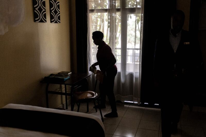 A staff member prepares a room at Hope Hostel, in Rwanda's capital Kigali, which is preparing to receive failed asylum seekers from the UK. AFP