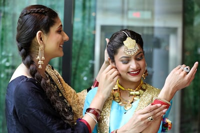 Members of he Sikh community getting ready for the event. Pawan Singh / The National