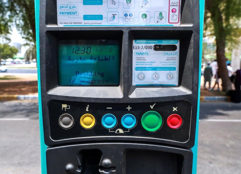 Abu Dhabi, U.A.E., July 11, 2018.  Stock photos of transportation - public buses, bus waiting sheds, taxis, passengers, bus ticket machines, mawaqif.  ---Mawaqif pay parking machine in front og the AUH Bus Terminal.
Victor Besa / The National
Section: NA
Reporter: