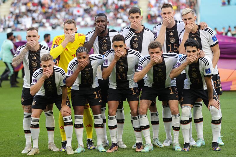 Germany's starting 11 pose for the team pre-match photo. EPA