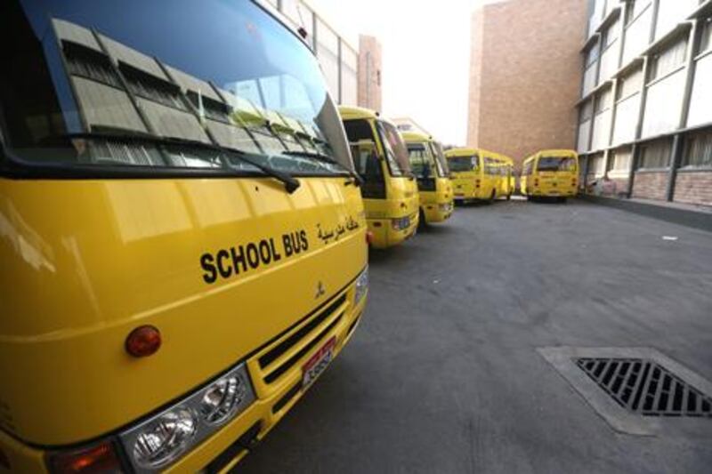 School buses have been painted yellow to comply with Adec/DOT regulations. Fatima Al Marzooqi/ The National
