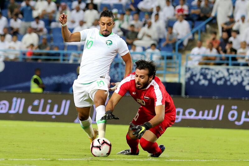 Saudi Arabia's Salem Al-Dawsari rounds Iraq's goalkeeper Mohammed Hassan Hameed Farhan. EPA