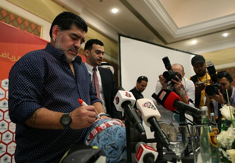 Diego Maradona a football as he was officially introduced to the media as the club's new manager at a press conference in Fujairah on Sunday, May 14, 2017. Satish Kumar / The National