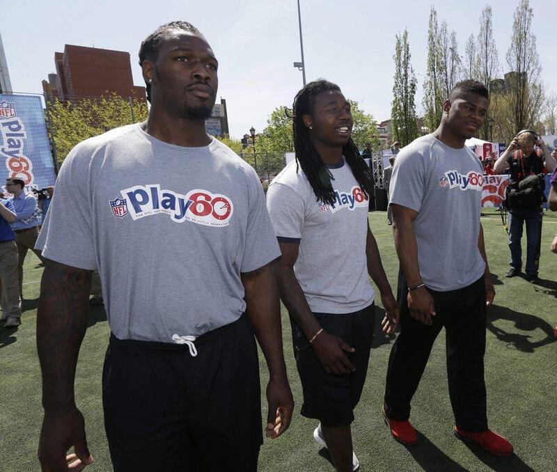 Jadeveon Clowney, left, Sammy Watkins, centre, and Khalil Mack participate in an NFL event in New York on Wednesday. Seth Wenig / AP / May 7, 2014 