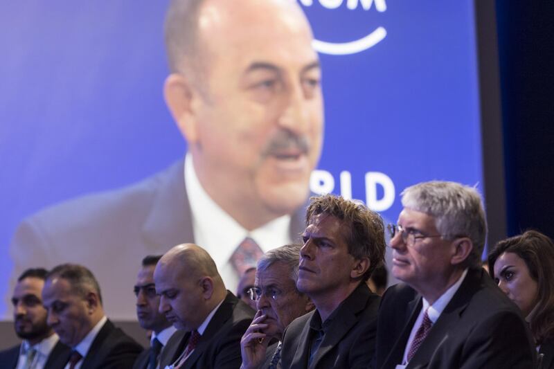 Participants listen to Mevluet Cavusoglu, Minister of Foreign Affairs of Turkey, addressing a panel session during the 50th annual meeting of the World Economic Forum (WEF) in Davos, Switzerland.  EPA