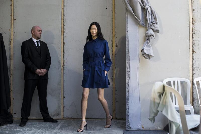 Qiwen Feng returns backstage after modeling at the Felipe Oliveira Baptista fashion show during the Spring/Summer 2014 Ready to Wear Paris Fashion Week, in Paris. Yoan Valat / EPA